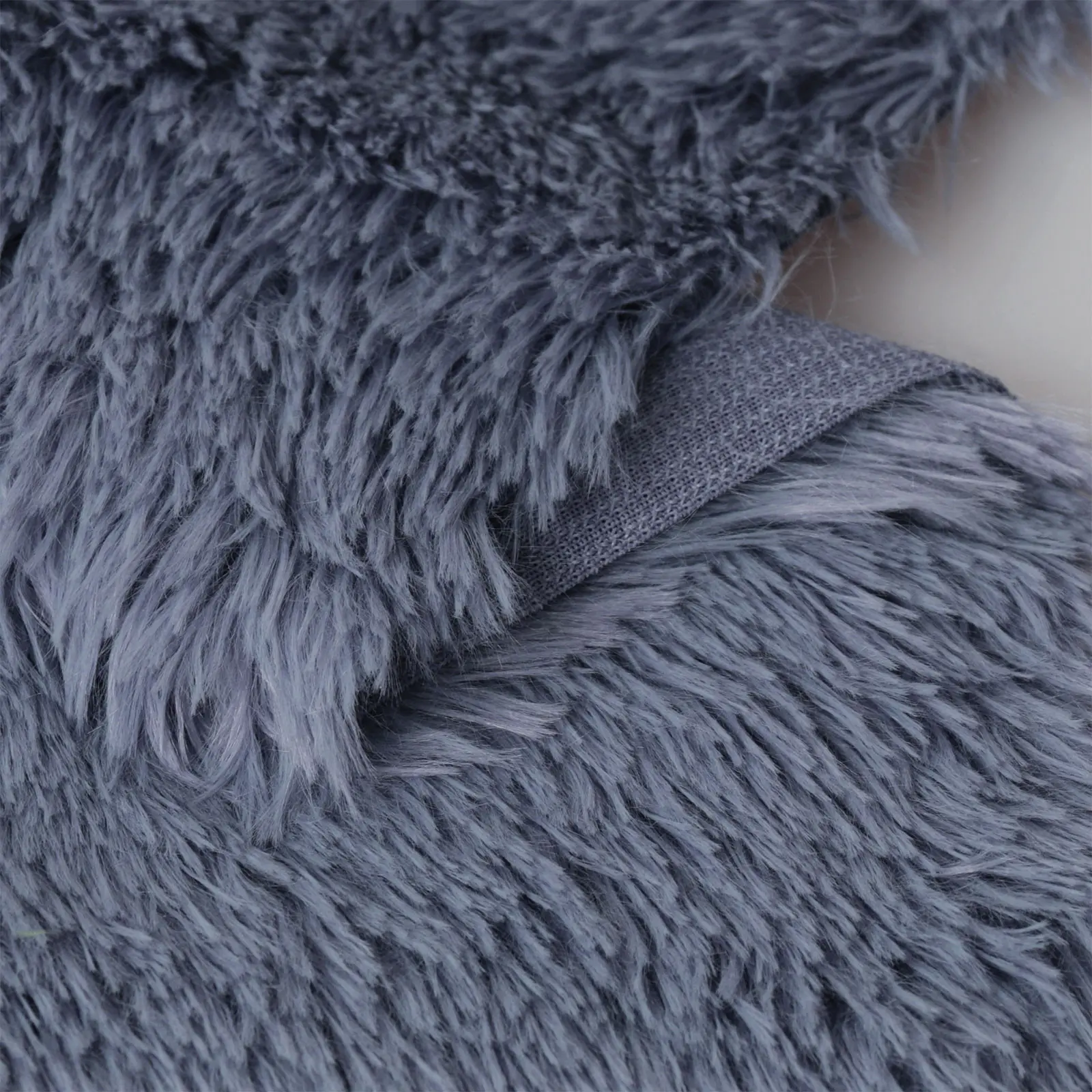 Gray blue plush fabric, fabric for sewing clothes, close up Stock Photo by  ndanko