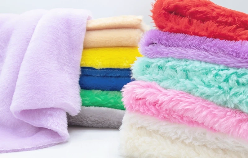 Unmatched Softness & Pile Density Detailed close-up of premium faux rabbit fur fabric showing dense and silky synthetic pile