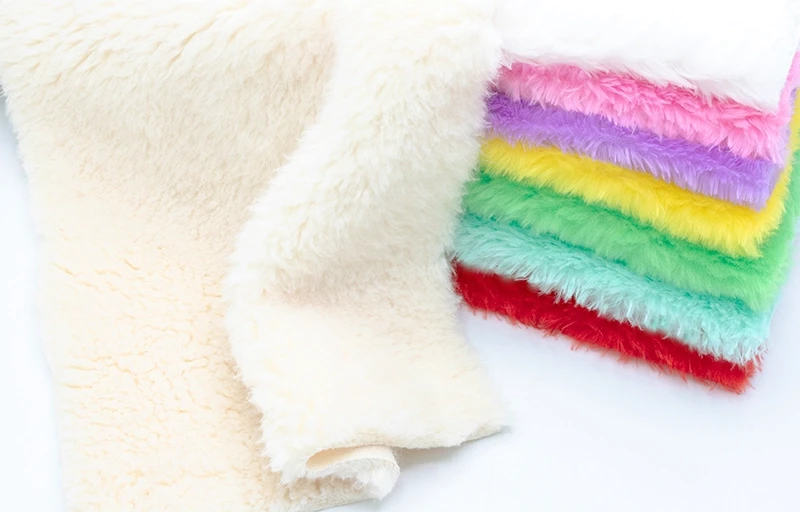 Close-up Texture of Faux Rabbit Fur Macro shot of soft white faux rabbit fur fabric highlighting the dense pile and silky finish.