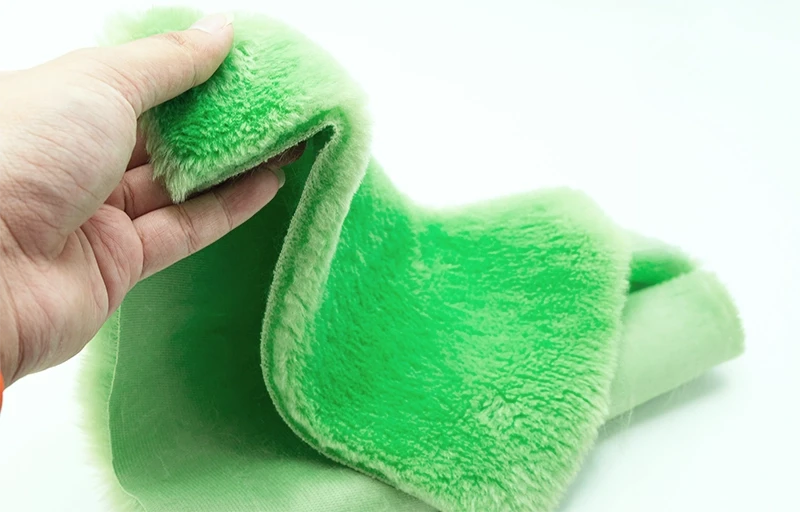 Sustainable Textile Innovation: Recycled Faux Fur Close-up of dense, soft faux rabbit fur fibers produced from sustainable recycled polyester (rPET).