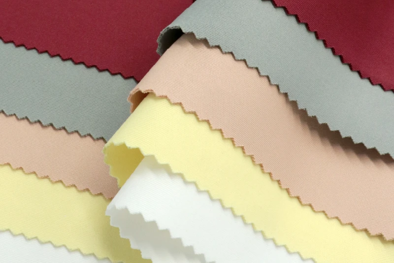 Promotional banner for Jong Stit's Double Knit fabric, highlighting its elasticity, ultimate comfort, shape retention, and wash-resistant durability for endless lifestyles.