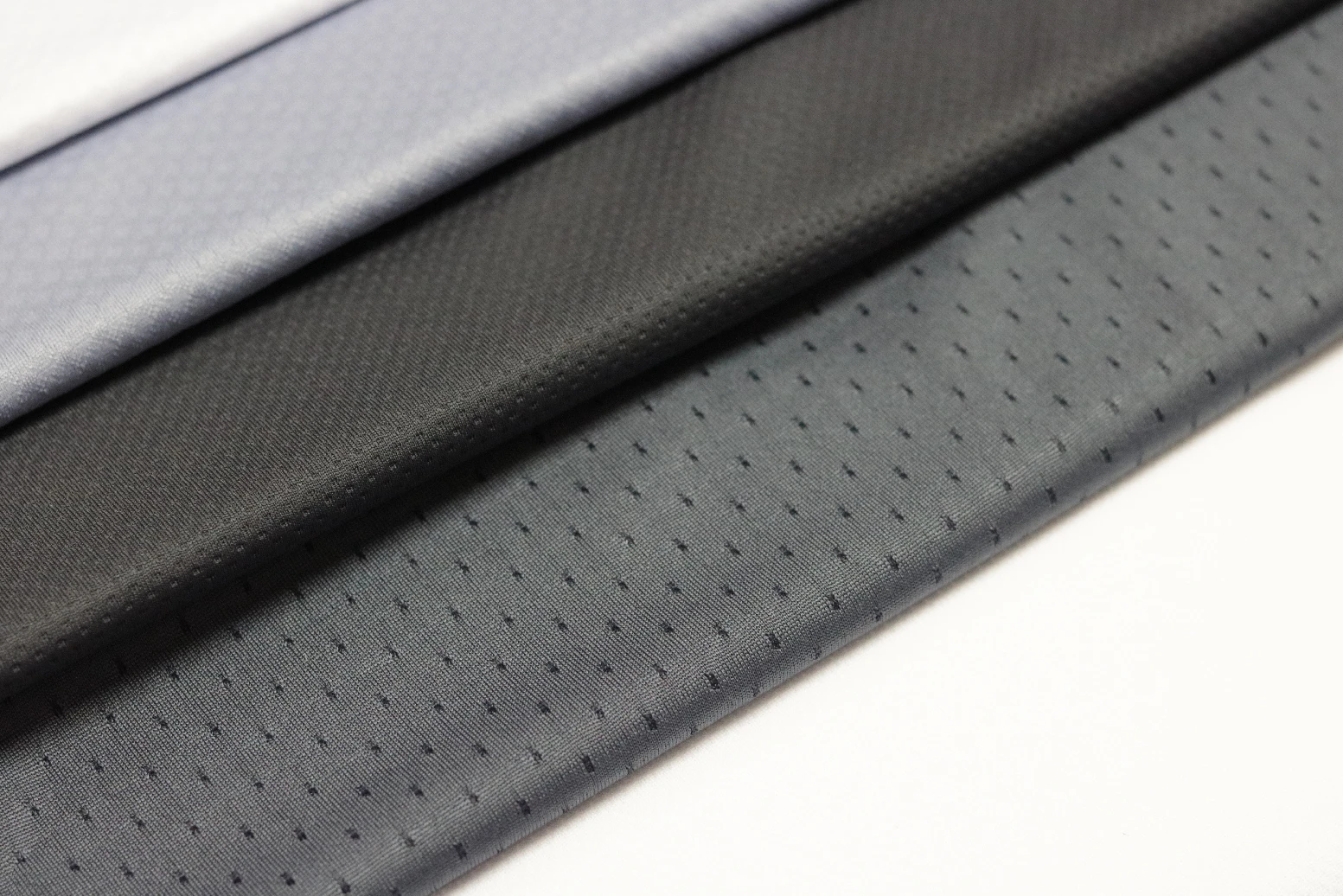Advantages of polyester fabric grey color sport fabric